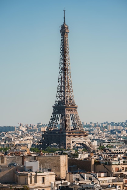 Daytime shot of the Eiffel Tower under a clear blue sky in Paris France