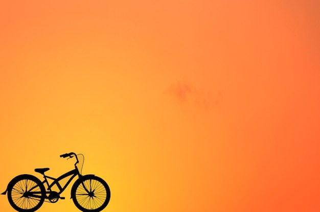 De Abstracte Achtergrond van het fietssilhouet in Natuurlijke Zonsondergang