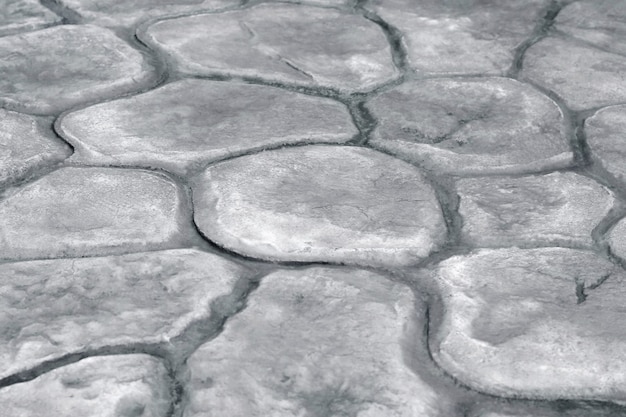 Foto de achtergrond van de steengang, grijze rotstextuur in natuurlijk patroon.