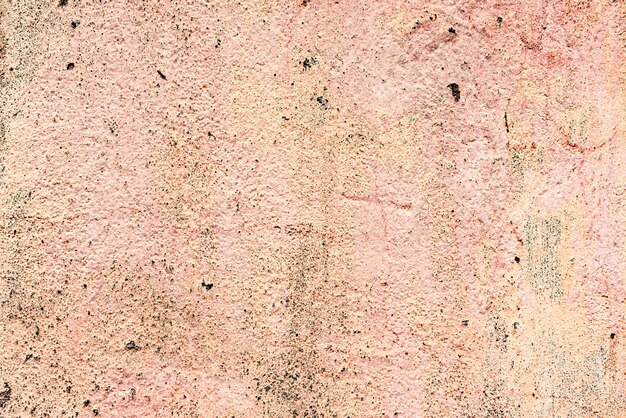 De achtergrondmuur met stopverf schilderde roze textuuroppervlakte