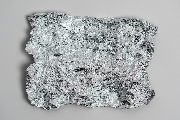 De aluminium zilver verfrommeld folie abstracte textuur