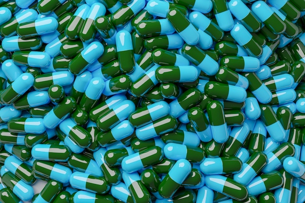 Foto de blauwe en groene capsules sluiten omhoog
