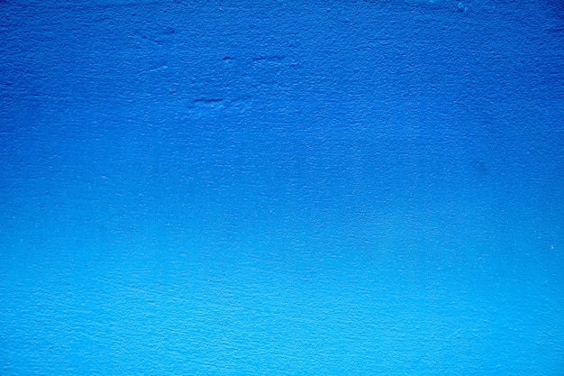 De blauwe textuur van de cementmuur - close-up