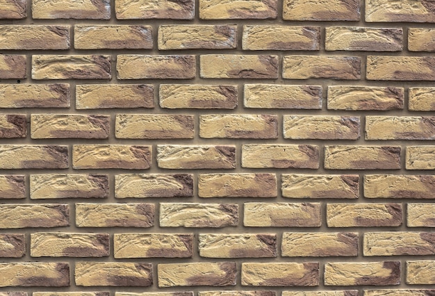 De blokken van massieve steen De muur van bruine steen