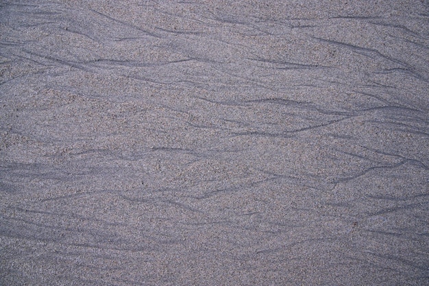 De door de natuur gecreëerde zandpatroontextuur kan als achtergrondbehang worden gebruikt