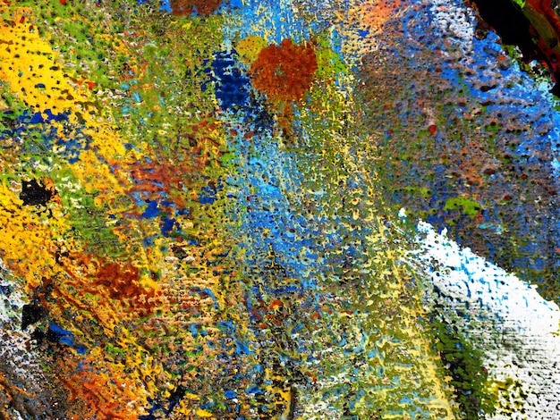 Foto de hand trekt de kleurrijke abstracte achtergrond van het textuurolieverfschilderij op houten.