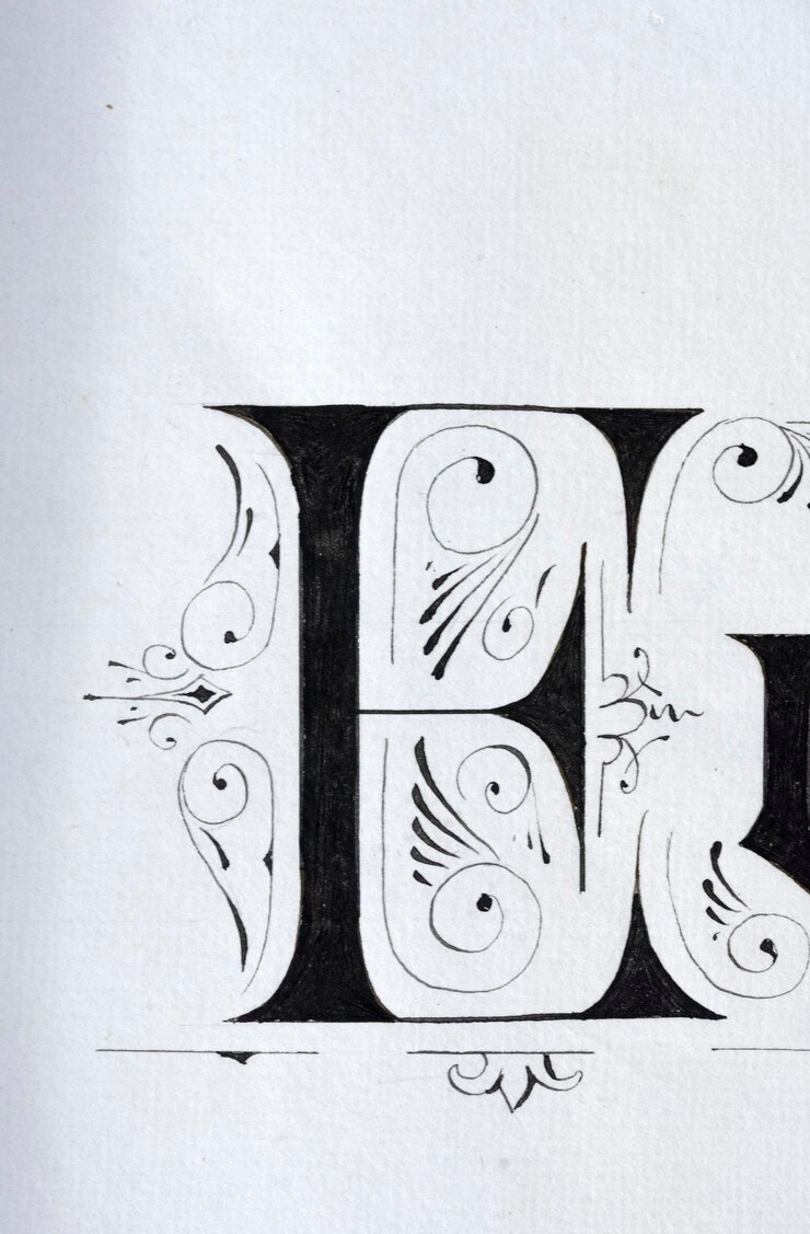 Foto de letter e met een speld op wit papier