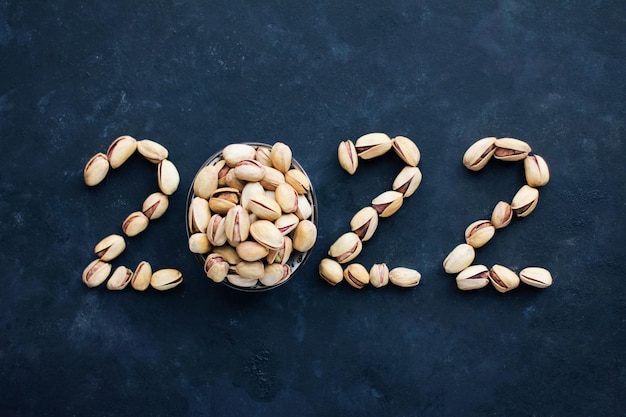 De nummers 2022 zijn gemaakt van het eten van pistachenoten, nieuwjaar en kerst, gezonde voeding en een symbool van het nieuwe jaar