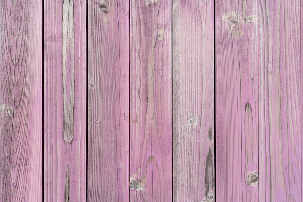 De roze achtergrond van houten planken bekijken van bovenaf