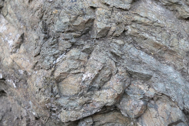 De textuur van de rotsclose-up op de steen in de bergen