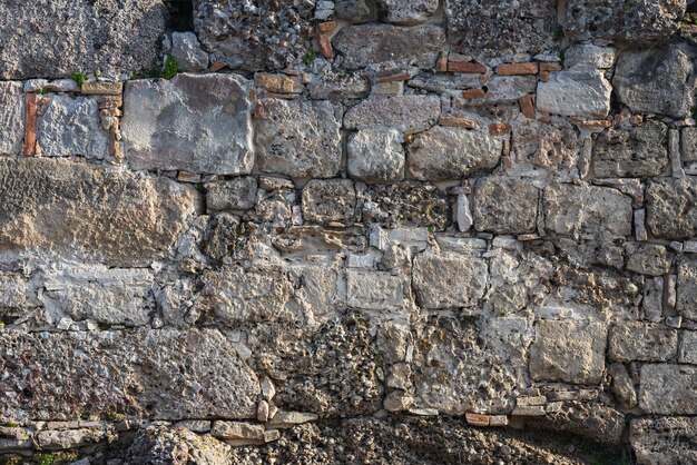De textuur van de stenen muur Achtergrondstructuur van de stenen muur van het oude kasteel