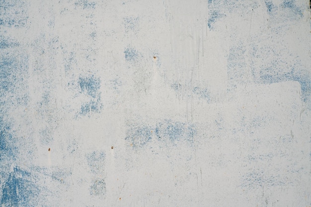 De textuur van een geverfde grijze muur