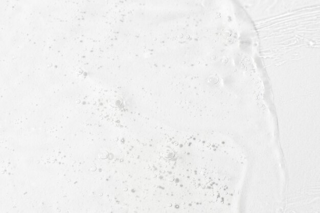 De textuur van het serum of de gel Transparante crème met bubbels op de achtergrond Transparante cosmetische gel in close-up xAOxygen bubbels xA