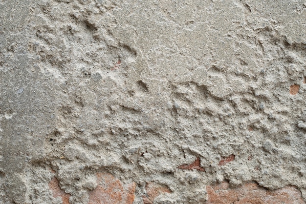 De textuur van oude grijze betonnen muren voor achtergrond, oppervlak en patroon van grijs cement.