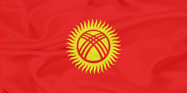 De vlag van Kirgizië zwaait in de wind