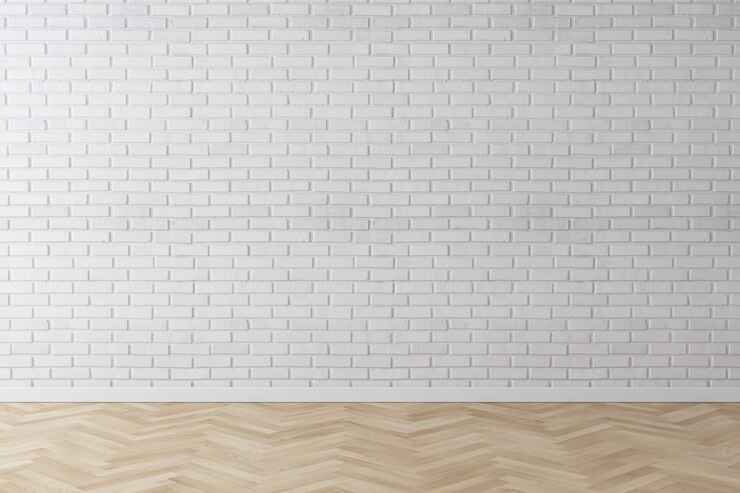 Foto de witte achtergrond van de muurbaksteen met visgraat houten vloer