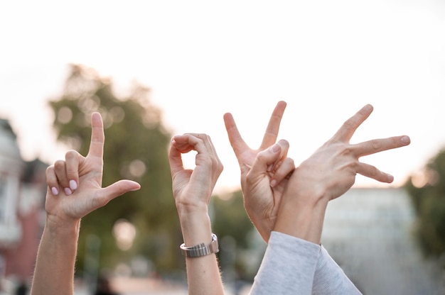 Photo deaf women communicating through sign language