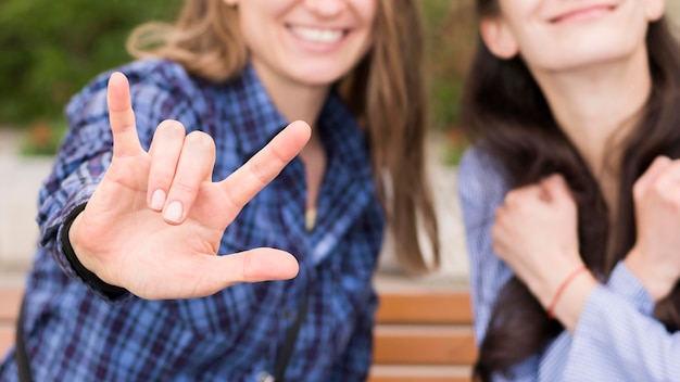 Photo deaf women communicating through sign language