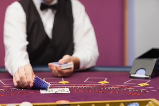 Dealer dealing cards in a casino