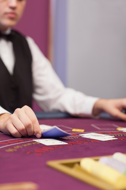 Dealer at table in a casino