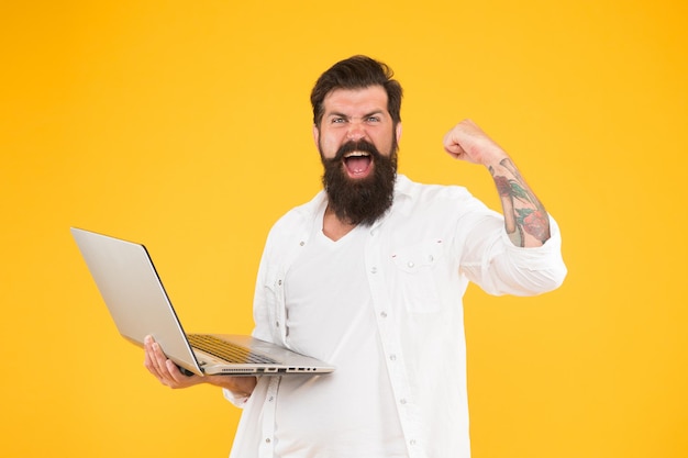 Dealt with this problem bearded man laptop yellow background\
shopping online successful developer education in digital world\
programming concept man surfing internet in search of\
inspiration