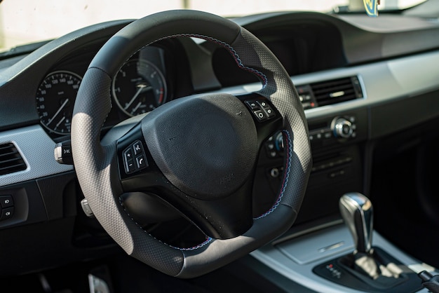 Deatail of generic Luxury car interior in natural light