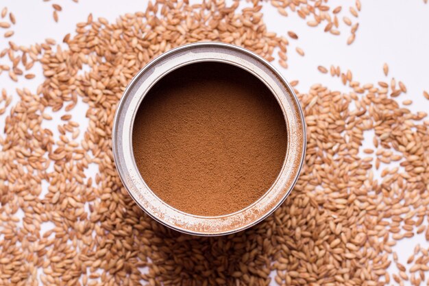 Decaffeinated coffee substitute from oats in a can on a white background. View from above