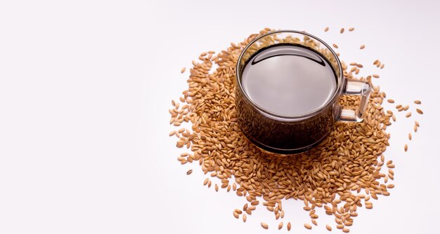 Decaffeinated coffee substitute made from oats on a white background. Copy space.