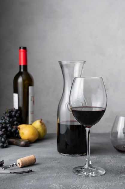 Decanter and wine glass on table