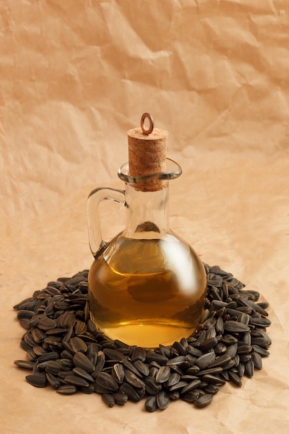 Decanter with sunflower oil on seeds