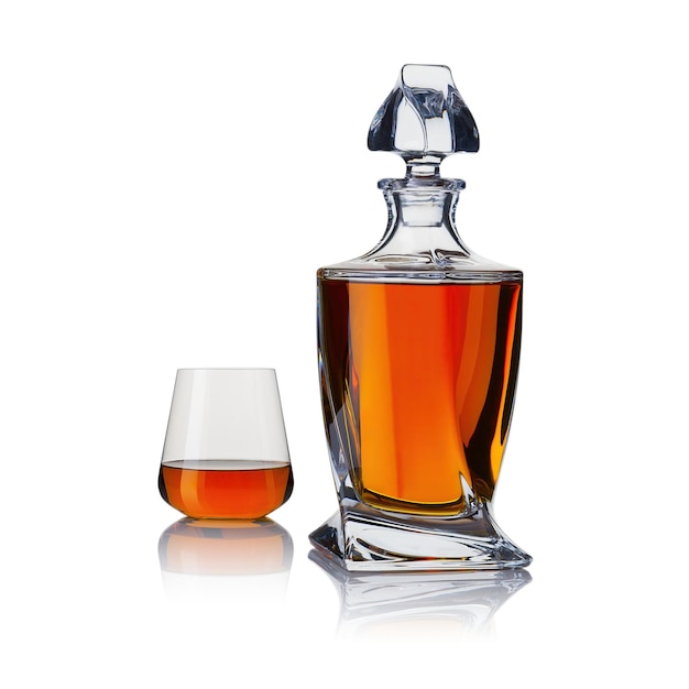 Decanter with whiskey and whiskey glasses carafe and glass of whiskey on a white background