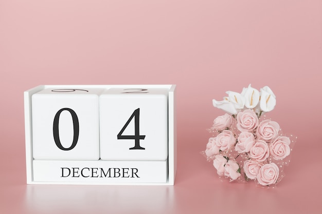 December 04th. Day 4 of month. Calendar cube on modern pink background, concept of bussines and an importent event.