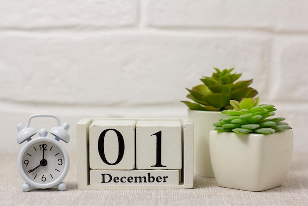 December 1 on the calendar next to the alarm clock is the start date of the new month