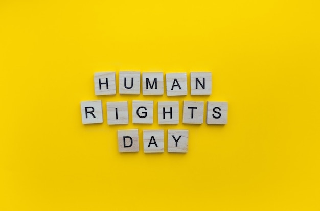 December 10 human rights day minimalistic banner with the inscription in wooden letters