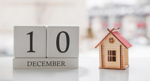 December calendar and toy home. Day 10 of month. Card message for print or remember