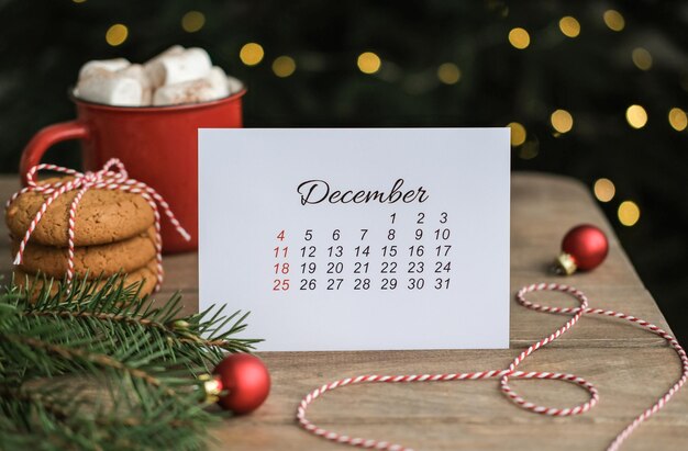 December calendar with christmas decorations around