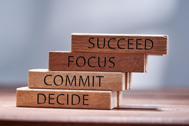 Decide commit focus and succeed text on wood block