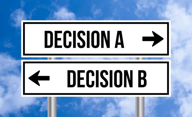 Photo decision a or decision b road sign on blue sky background