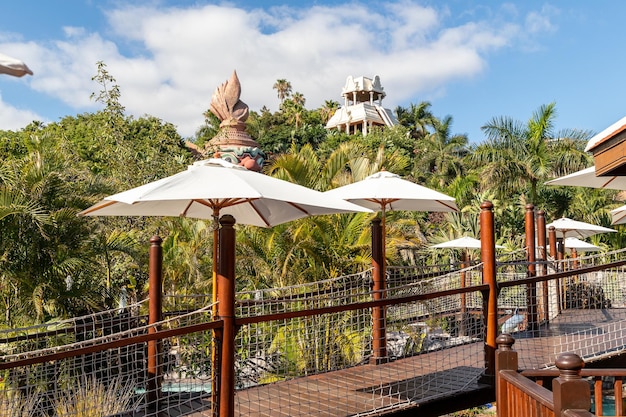 The deck of the resort has a view of the ocean and the hotel.