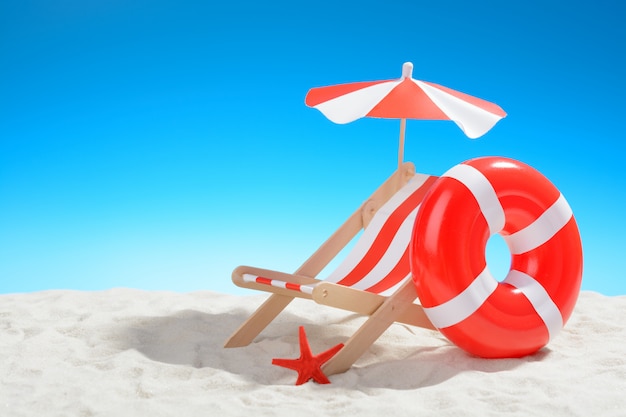 Deckchair and swimming ring on the beach