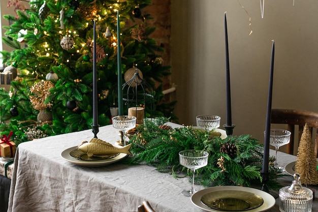 a decorated christmas dining table with christmas tree restaraunt menu