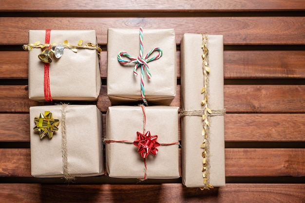 Decorated Christmas gifts on a wooden table