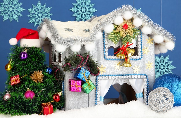 Decorated Christmas house on blue background