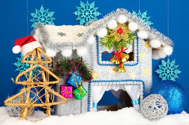 Decorated Christmas house on blue background