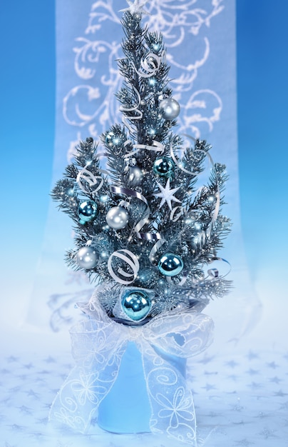 Photo decorated christmas tree on blue