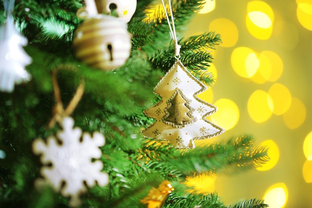 Decorated Christmas tree on blurred, sparkling and fairy background