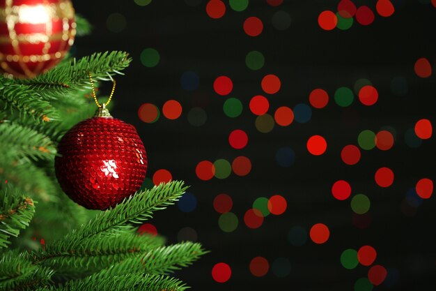 Decorated Christmas tree on  blurred, sparkling and fairy surface