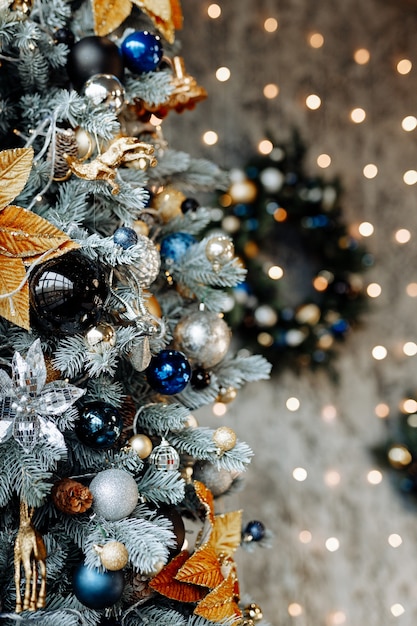 Decorated Christmas tree on a blurry dark