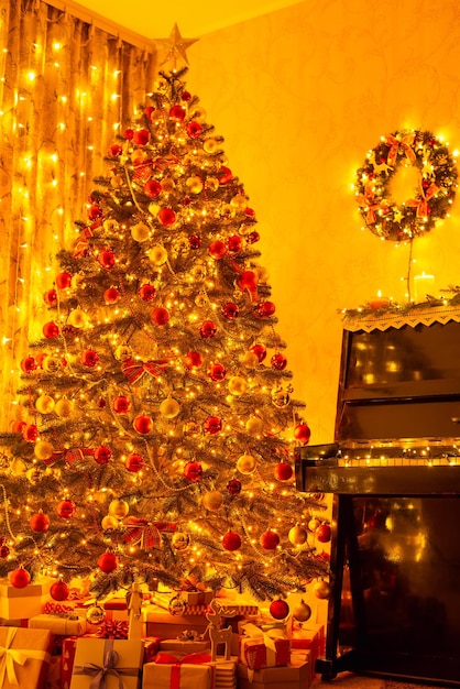 Decorated christmas tree at home near piano full of bright lights Christmas festive atmosphere