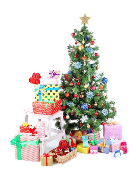 Decorated Christmas tree with gifts isolated on white